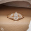 Pear Cut Engagement Ring with Matching Side Stones and Round Accent Details