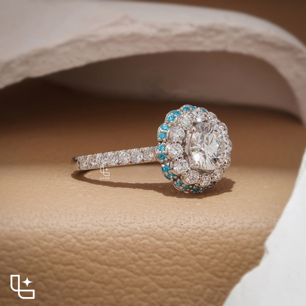 Round Cut Floral Halo Engagement Ring with Blue Accent Stones