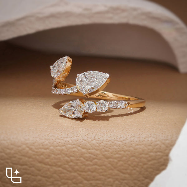Three Stone Pear Cut Ring with Open Bypass Band and Pavé Accents