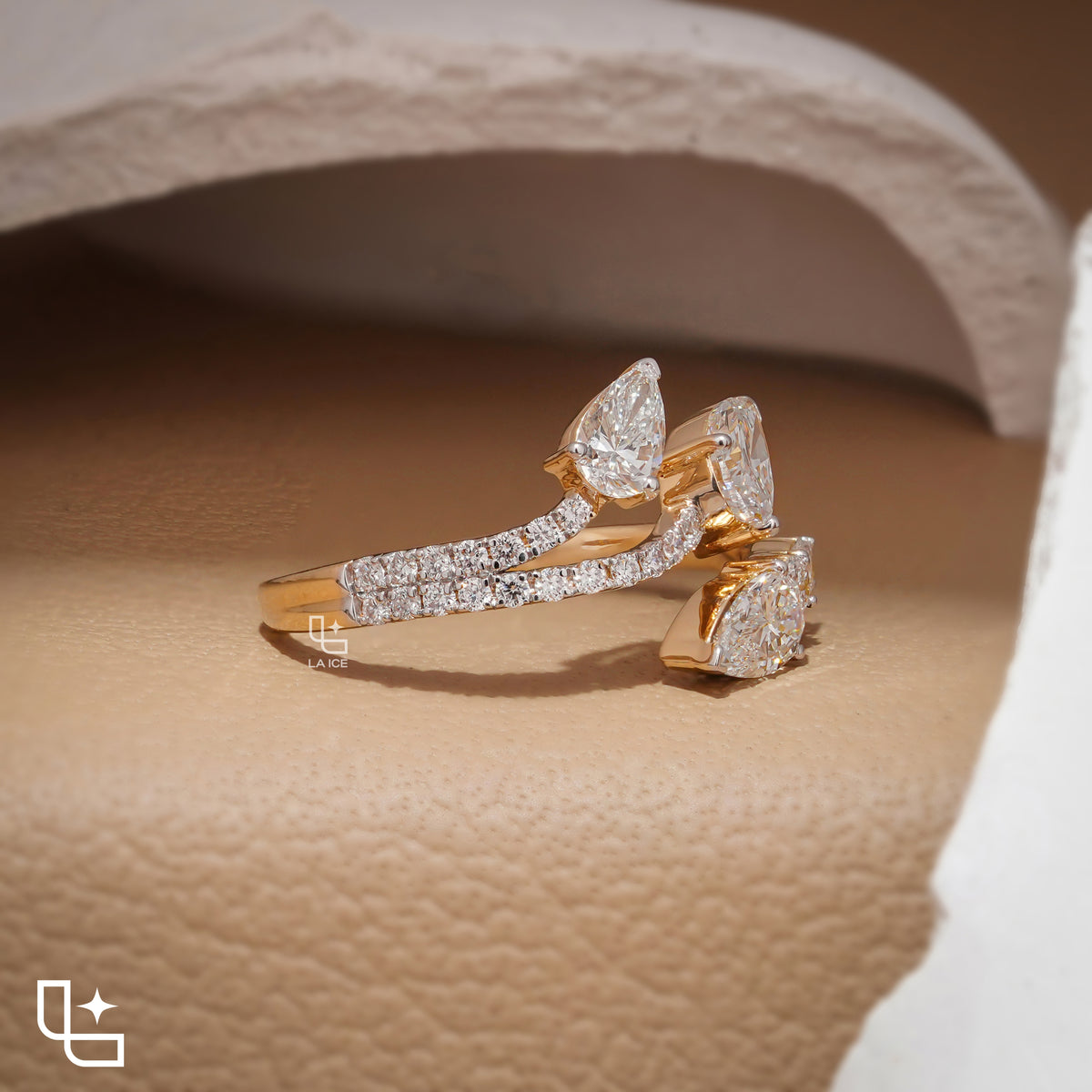 Three Stone Pear Cut Ring with Open Bypass Band and Pavé Accents