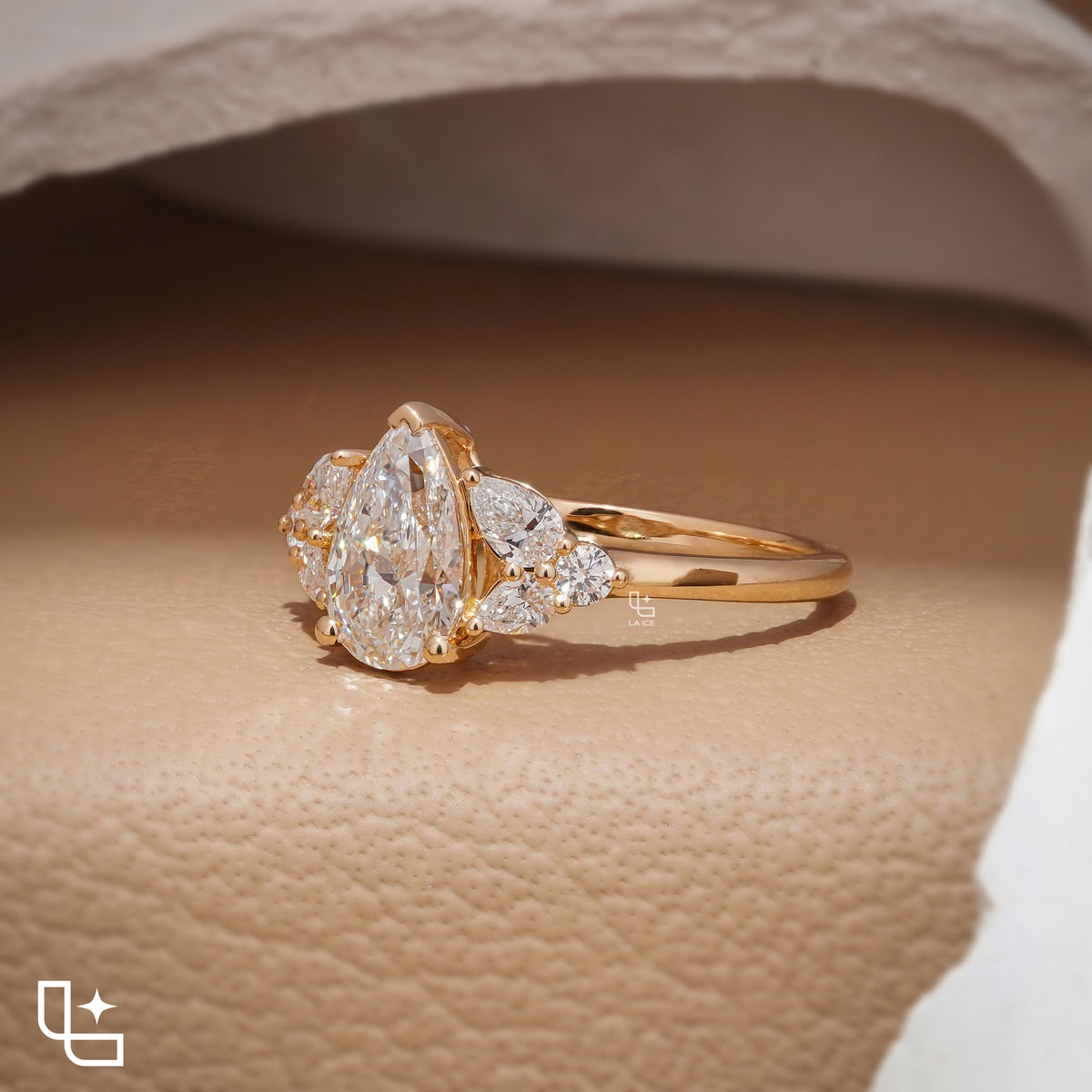 Pear Cut Engagement Ring with Matching Side Stones and Round Accent Details