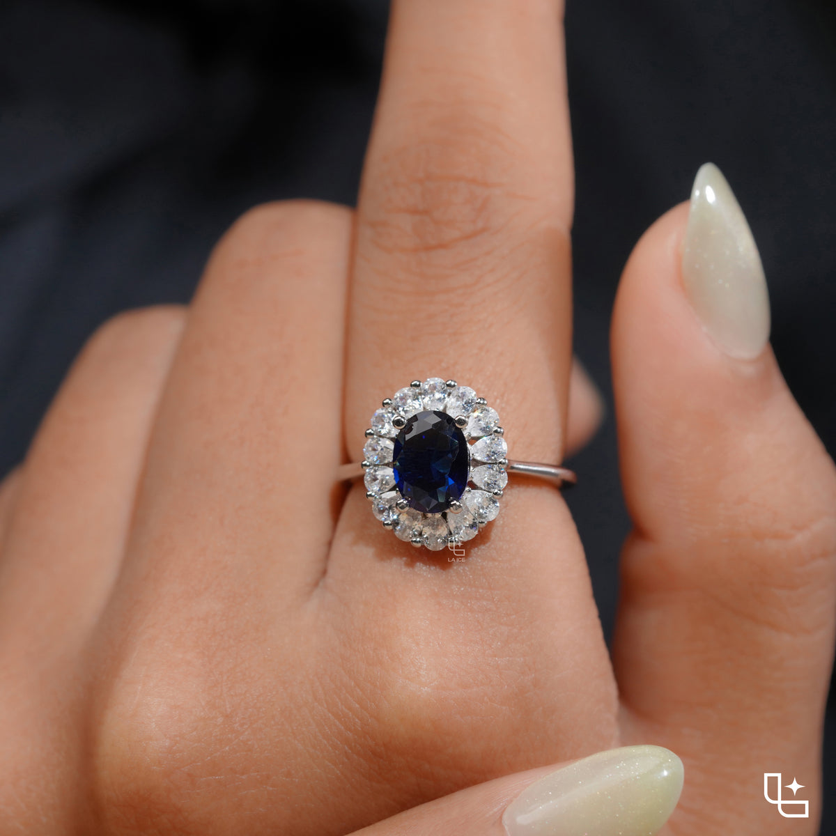Blue Oval Halo Engagement Ring with Floral Accent Stones