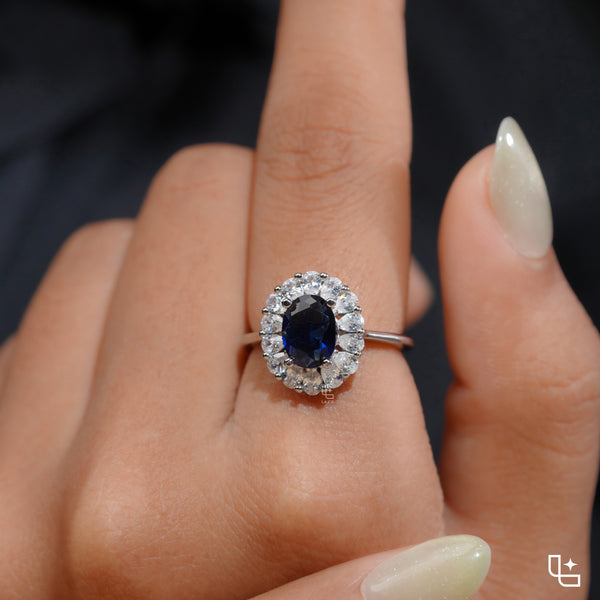 Blue Oval Halo Engagement Ring with Floral Accent Stones