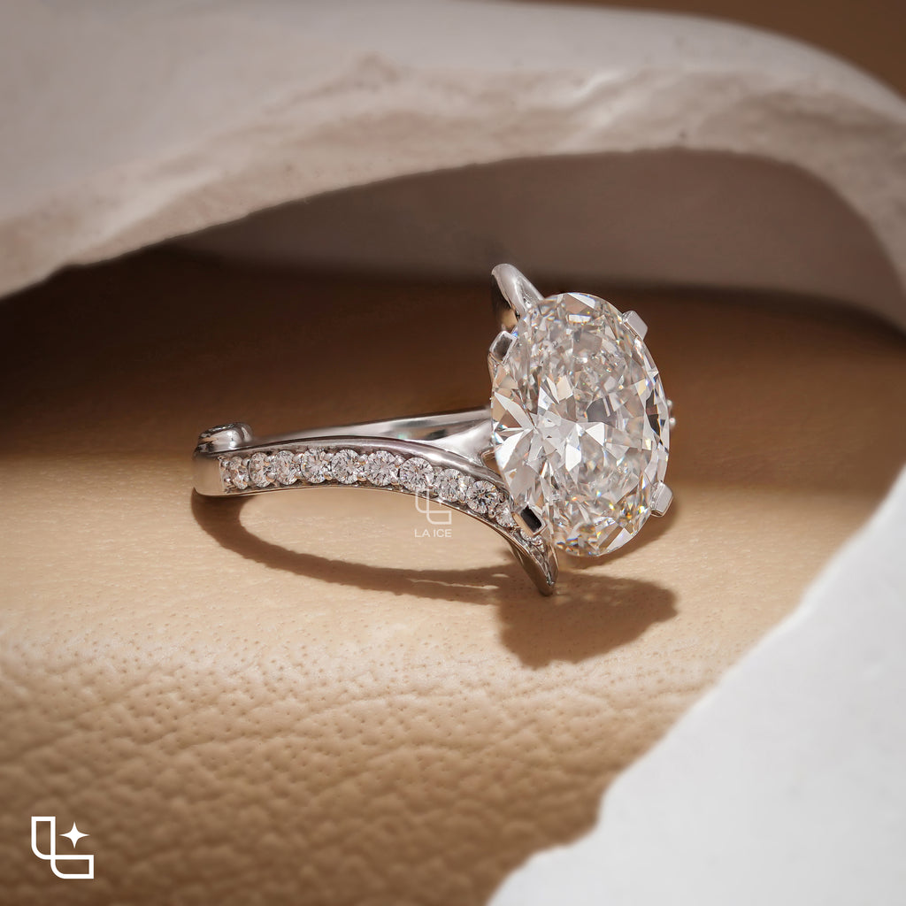 Oval Cut Pavé Engagement Ring with Brilliant Center Stone and Sparkling Side Stones