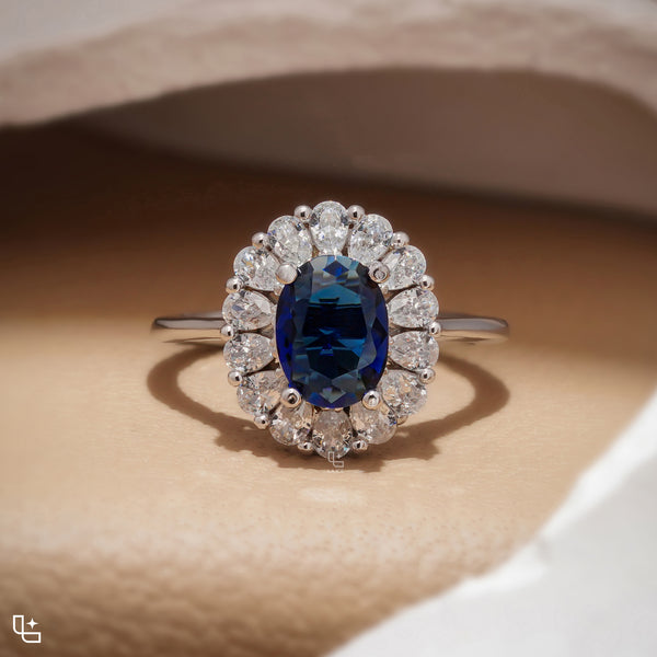 Blue Oval Halo Engagement Ring with Floral Accent Stones