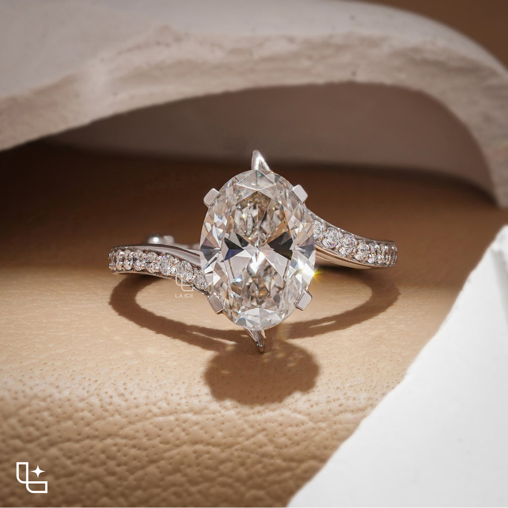 Oval Cut Pavé Engagement Ring with Brilliant Center Stone and Sparkling Side Stones