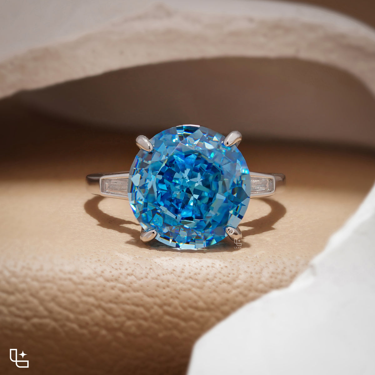 Round Blue Center Stone Solitaire Ring with Baguette Side Accents