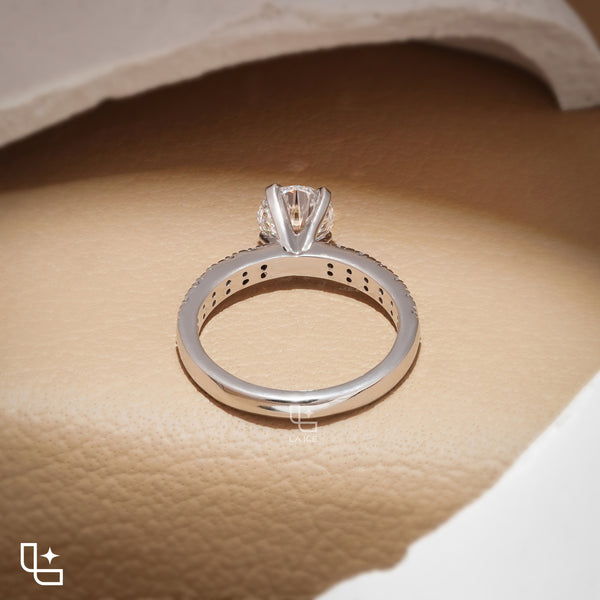 Round Cut Pavé Engagement Ring with Brilliant Center Stone and Sparkling Side Stones