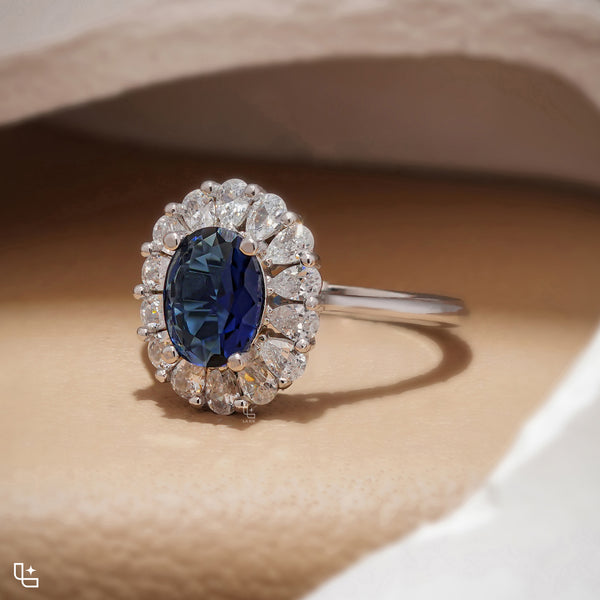 Blue Oval Halo Engagement Ring with Floral Accent Stones