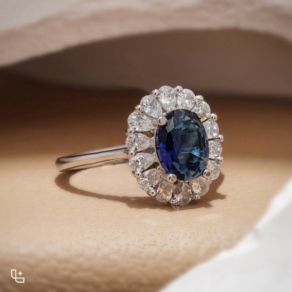 Blue Oval Halo Engagement Ring with Floral Accent Stones