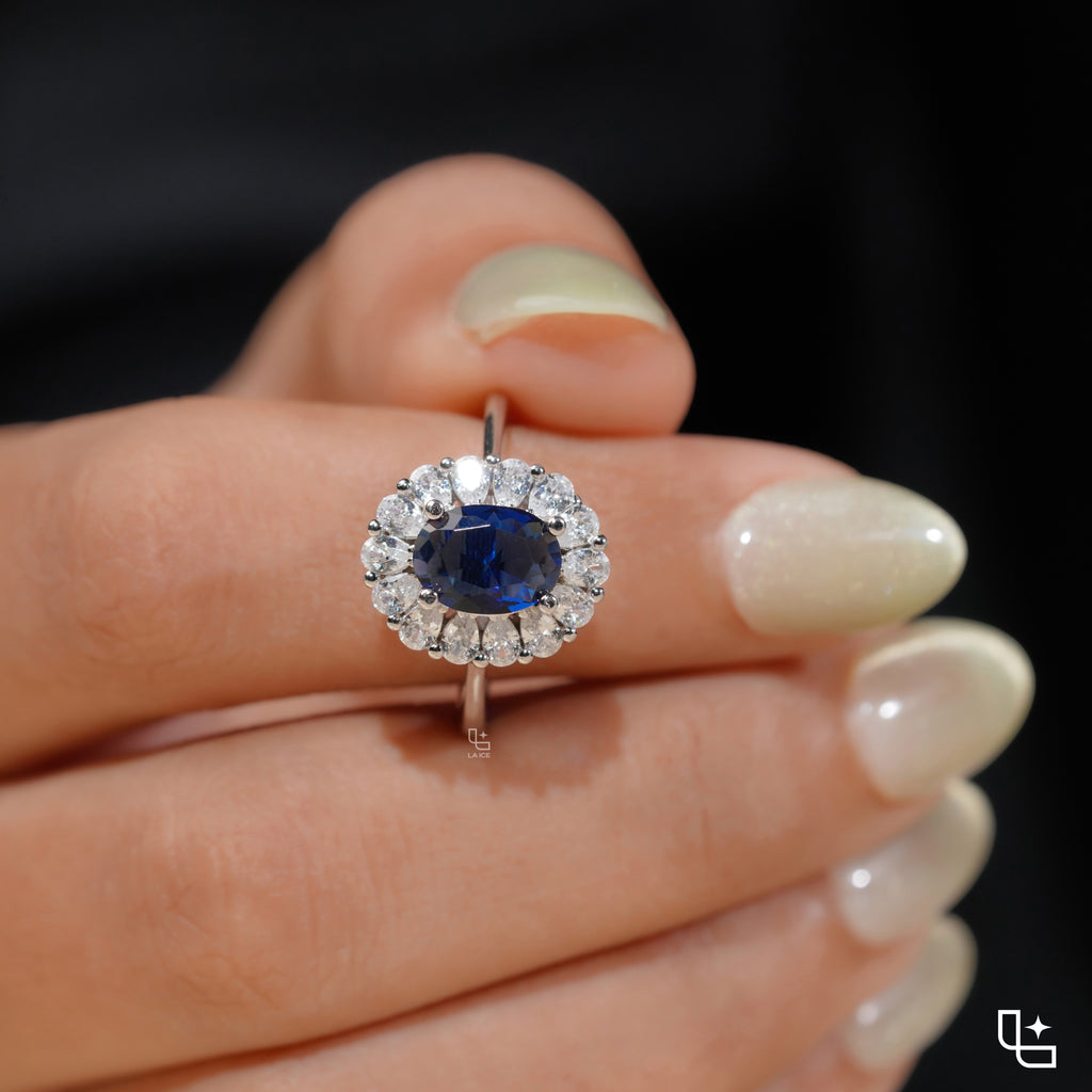 Blue Oval Halo Engagement Ring with Floral Accent Stones