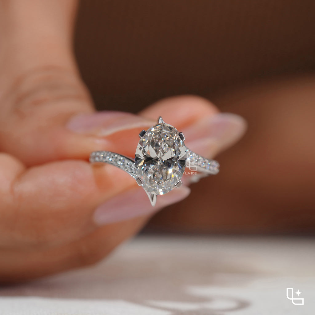 Oval Cut Pavé Engagement Ring with Brilliant Center Stone and Sparkling Side Stones