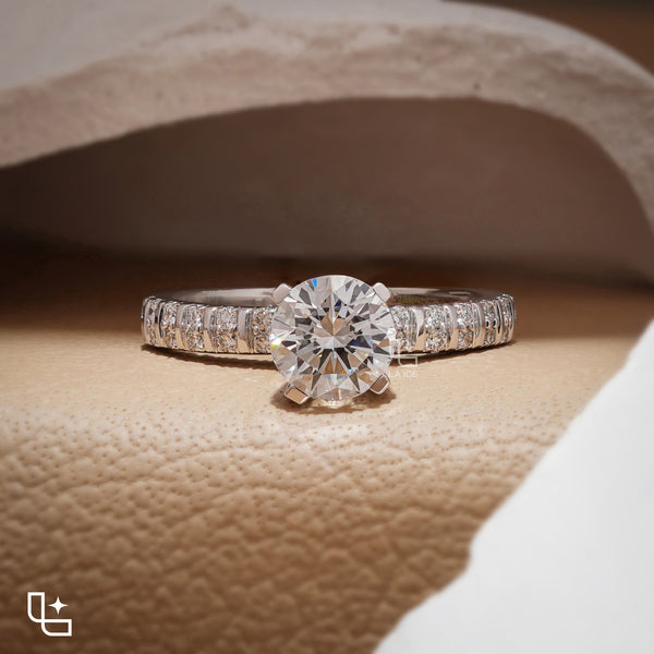 Round Cut Pavé Engagement Ring with Brilliant Center Stone and Sparkling Side Stones