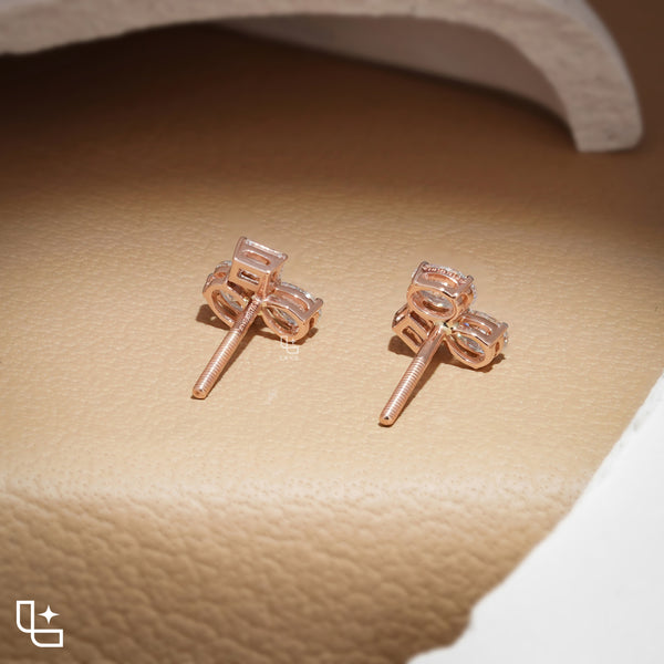 Three Stone Cluster Stud Earrings | Emerald Cut and Pear Shaped Cluster Stud Earrings with Round Accents, 1.50 CT Total Diamond Weight