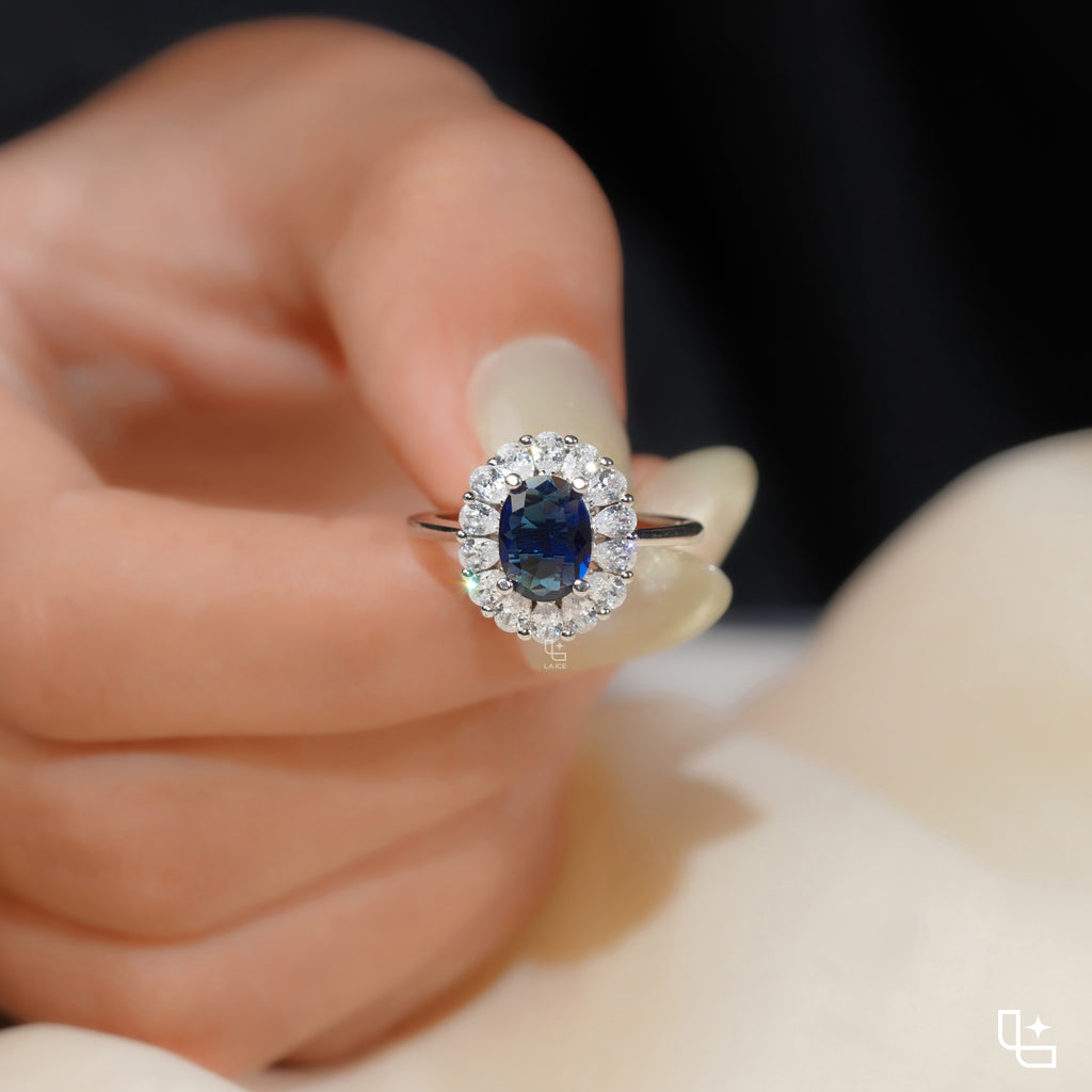 Blue Oval Halo Engagement Ring with Floral Accent Stones