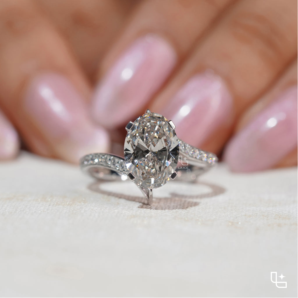 Oval Cut Pavé Engagement Ring with Brilliant Center Stone and Sparkling Side Stones