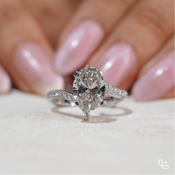 Oval Cut Pavé Engagement Ring with Brilliant Center Stone and Sparkling Side Stones