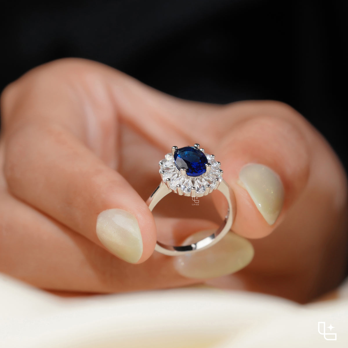 Blue Oval Halo Engagement Ring with Floral Accent Stones