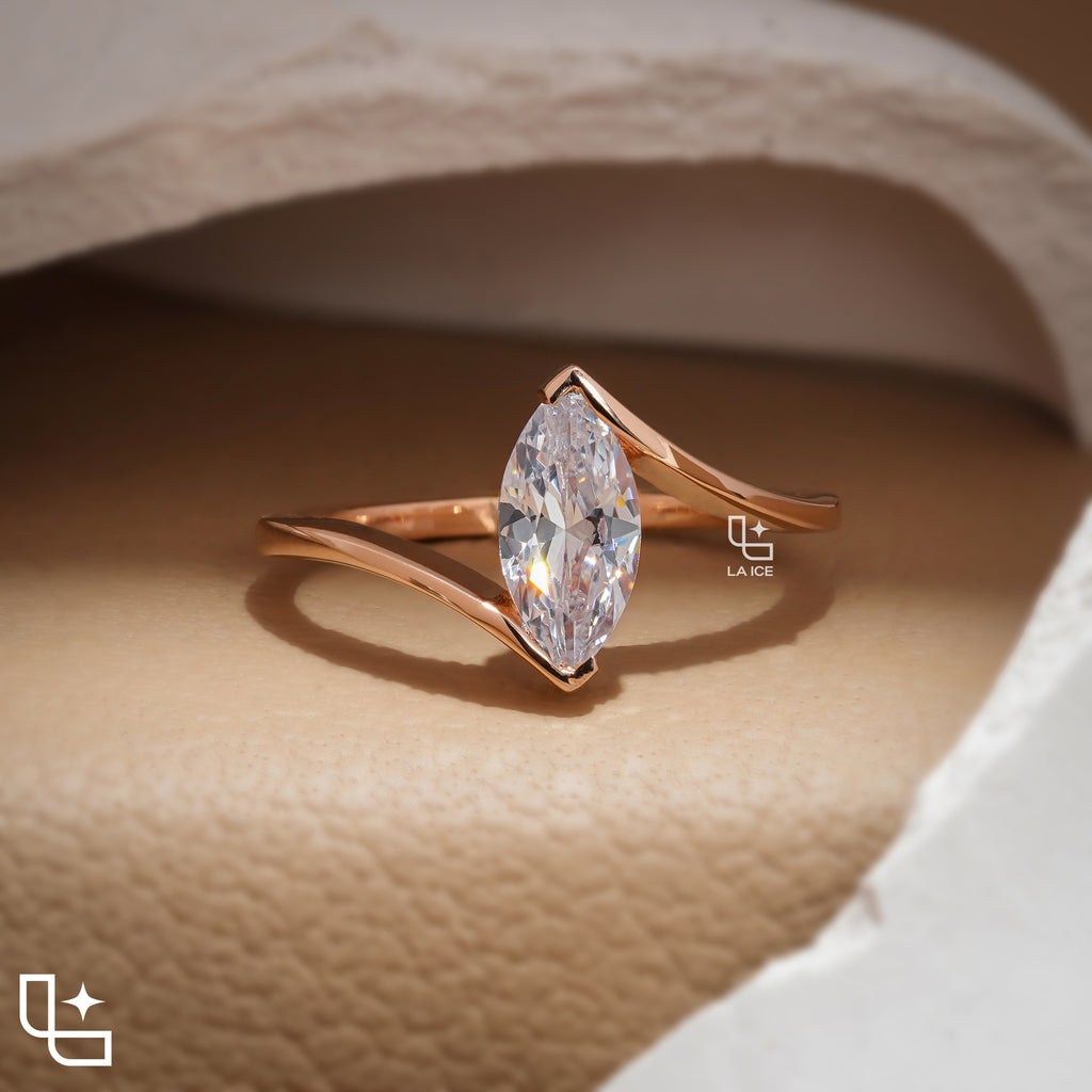Marquise Cut Solitaire Engagement Ring with Modern Bypass Band Design