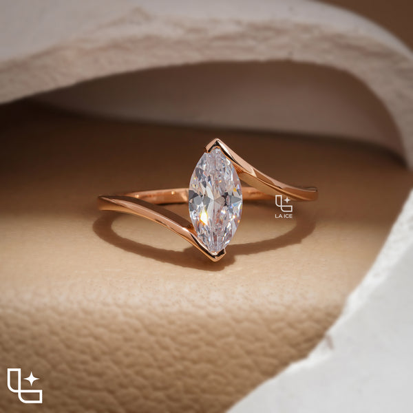 Marquise Cut Solitaire Engagement Ring with Modern Bypass Band Design