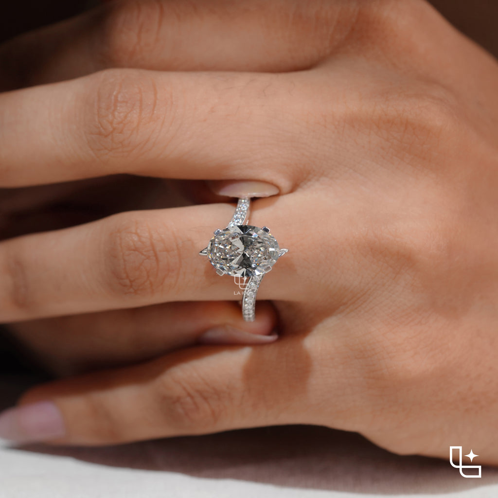 Oval Cut Pavé Engagement Ring with Brilliant Center Stone and Sparkling Side Stones