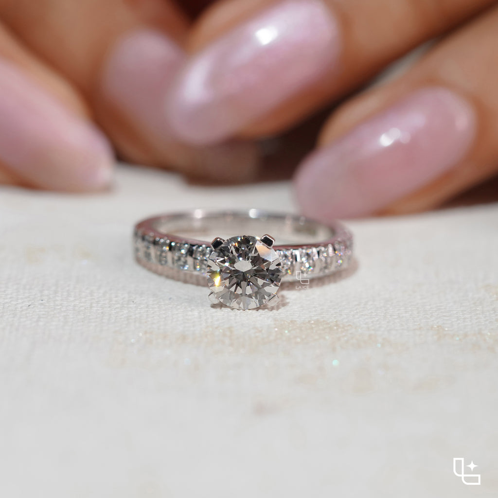 Round Cut Pavé Engagement Ring with Brilliant Center Stone and Sparkling Side Stones