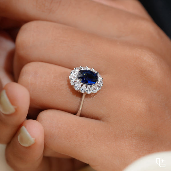 Blue Oval Halo Engagement Ring with Floral Accent Stones