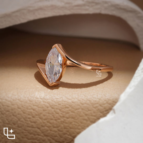 Marquise Cut Solitaire Engagement Ring with Modern Bypass Band Design