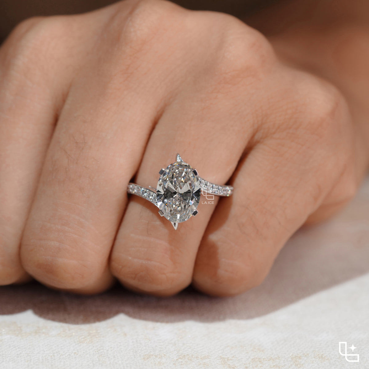 Oval Cut Pavé Engagement Ring with Brilliant Center Stone and Sparkling Side Stones