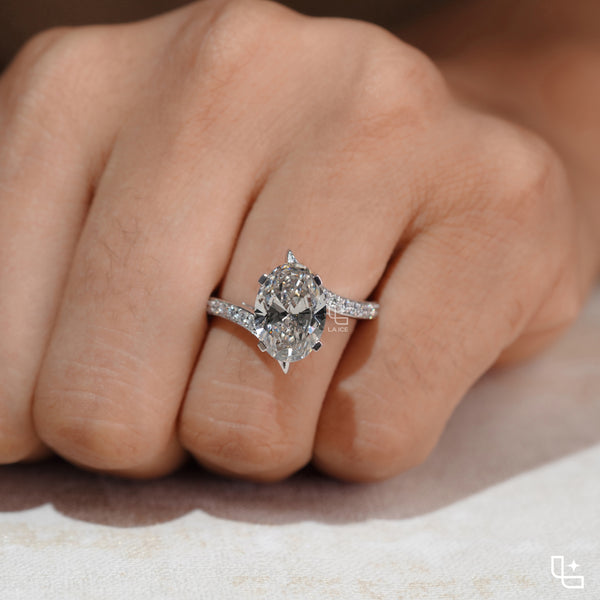 Oval Cut Pavé Engagement Ring with Brilliant Center Stone and Sparkling Side Stones