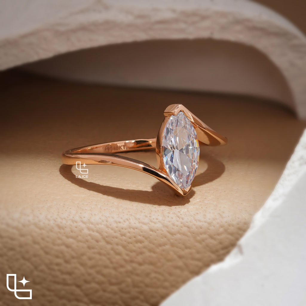Marquise Cut Solitaire Engagement Ring with Modern Bypass Band Design