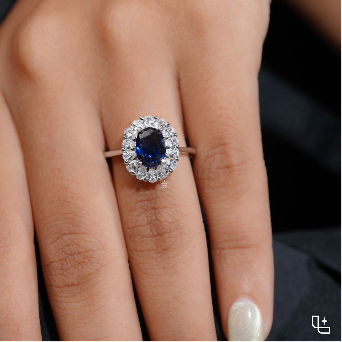 Blue Oval Halo Engagement Ring with Floral Accent Stones