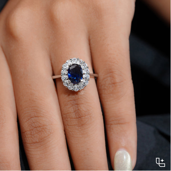 Blue Oval Halo Engagement Ring with Floral Accent Stones