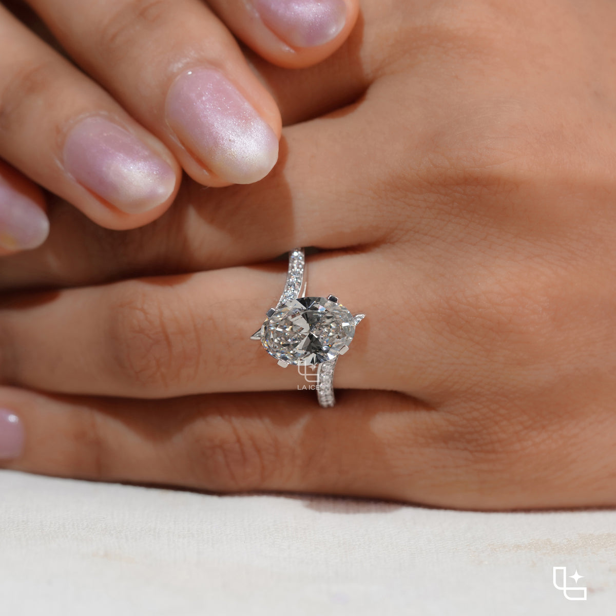 Oval Cut Pavé Engagement Ring with Brilliant Center Stone and Sparkling Side Stones