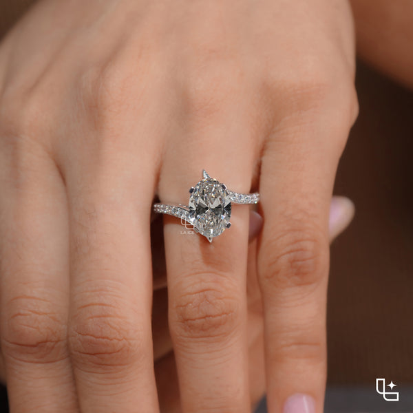 Oval Cut Pavé Engagement Ring with Brilliant Center Stone and Sparkling Side Stones