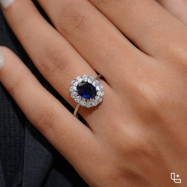 Blue Oval Halo Engagement Ring with Floral Accent Stones