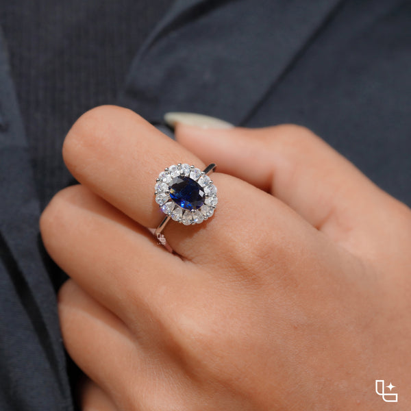 Blue Oval Halo Engagement Ring with Floral Accent Stones