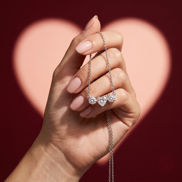 Three Stone Heart Pendant Necklace with Round Accents and Delicate Chain, 0.75 CT Diamond Weight, 2.50 g Metal Weight