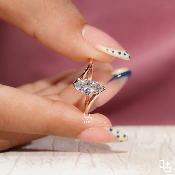 Marquise Cut Solitaire Engagement Ring with Modern Bypass Band Design