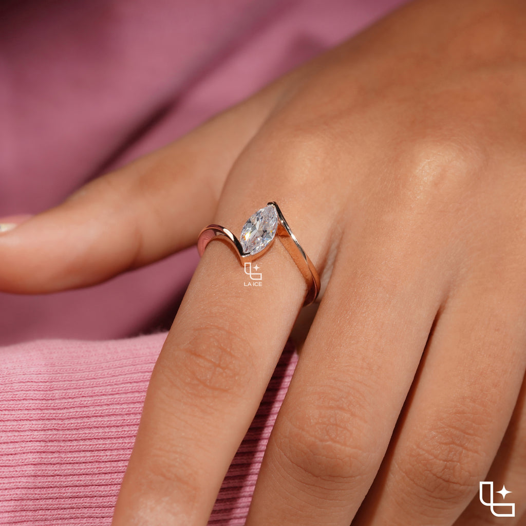 Marquise Cut Solitaire Engagement Ring with Modern Bypass Band Design