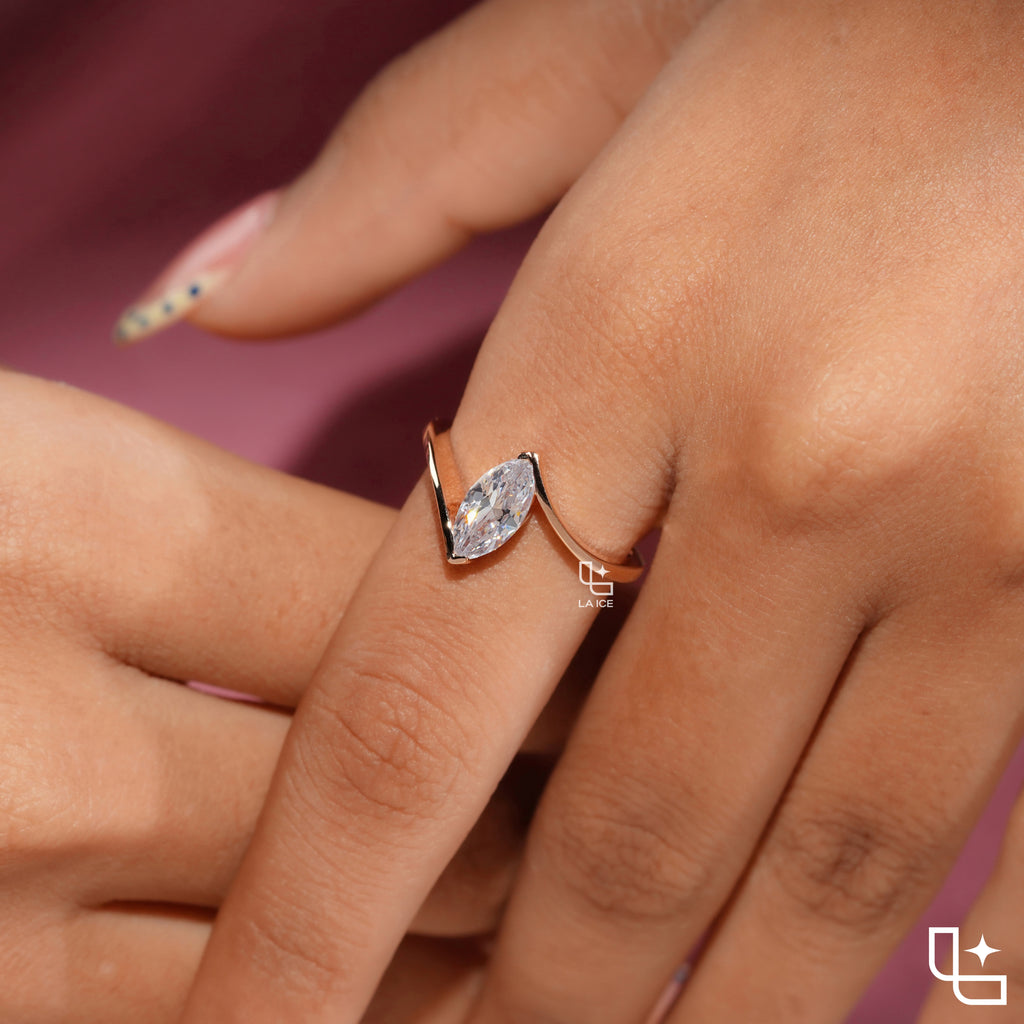 Marquise Cut Solitaire Engagement Ring with Modern Bypass Band Design