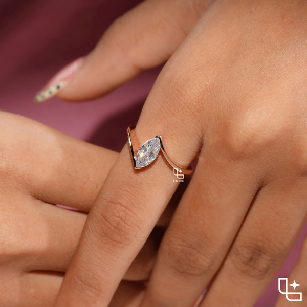 Marquise Cut Solitaire Engagement Ring with Modern Bypass Band Design