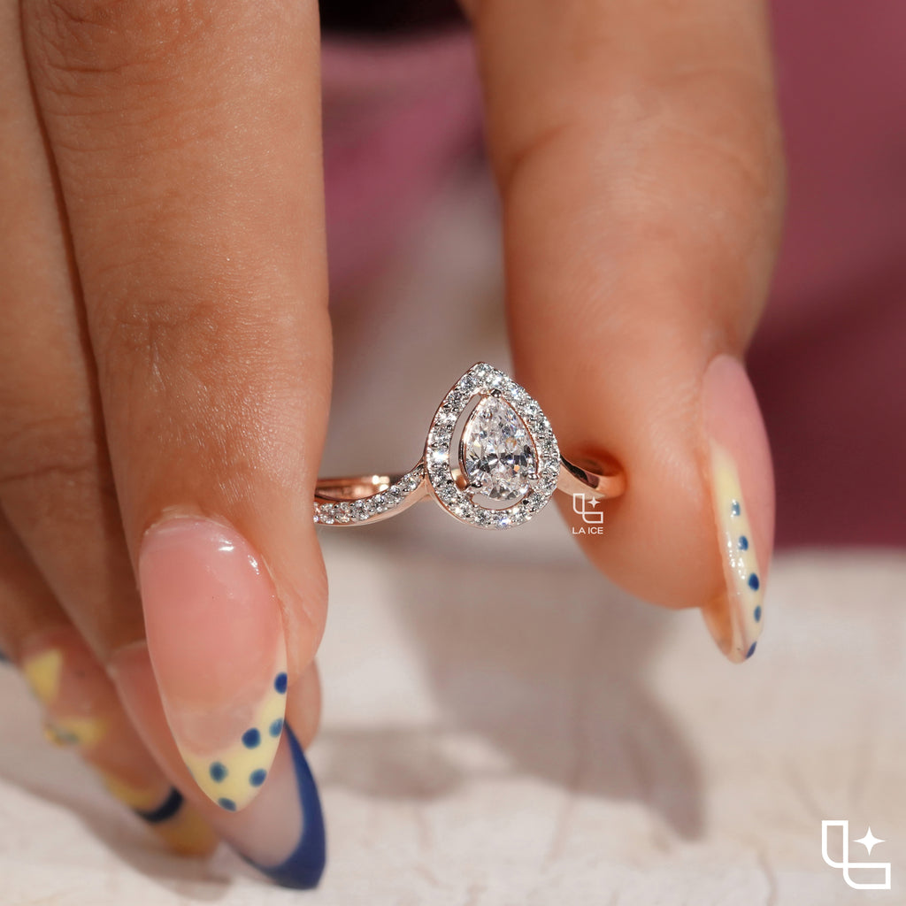 Pear Cut Halo Engagement Ring with Curved Band and Pavé Accent Stones