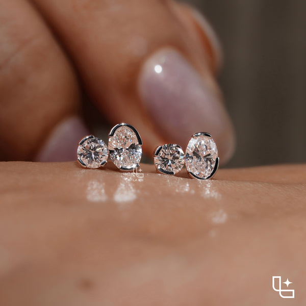 Oval and Round Cut Two Stone Stud Earrings with Asymmetrical Design, 1.50 CT Total Diamond Weight