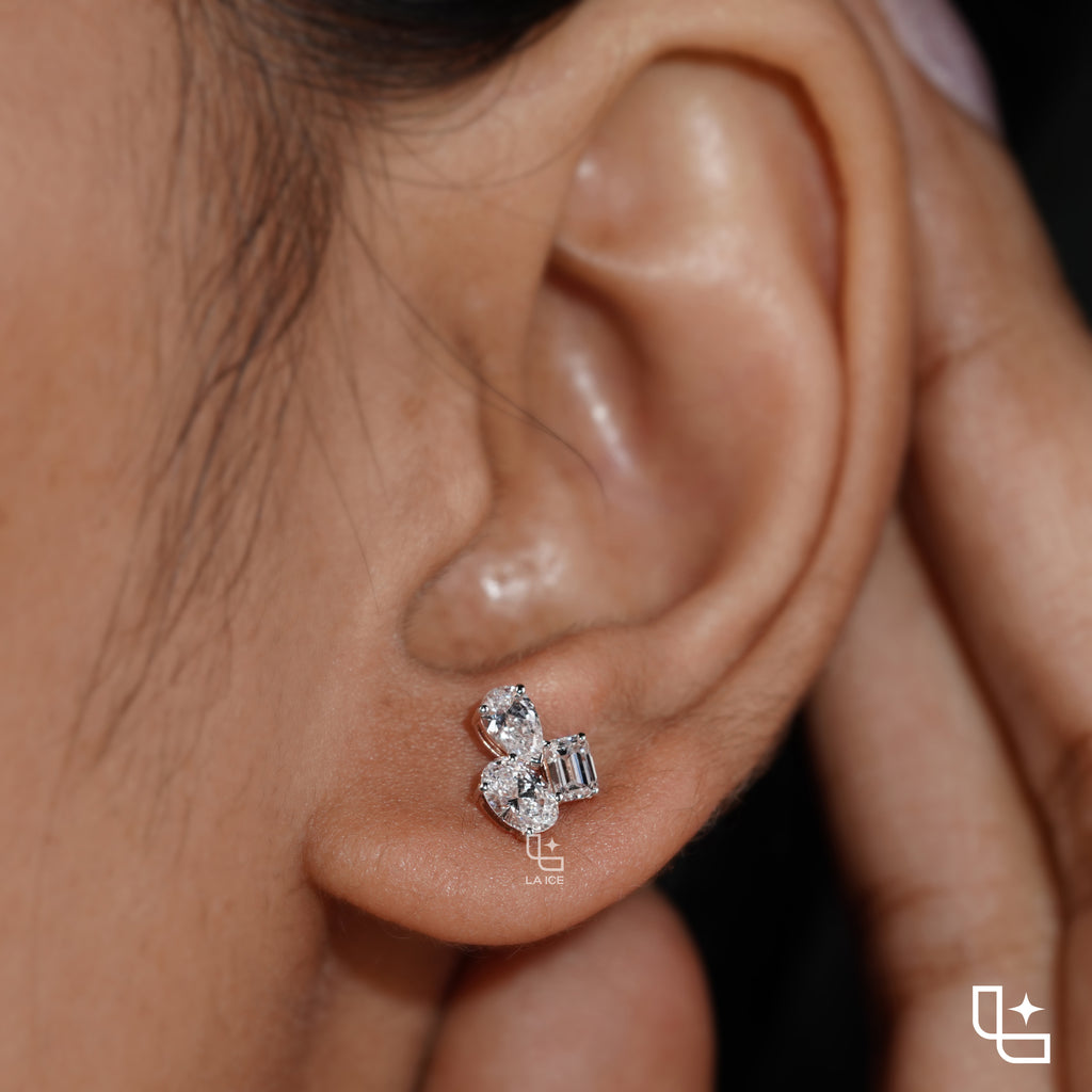 Three Stone Cluster Stud Earrings | Emerald Cut and Pear Shaped Cluster Stud Earrings with Round Accents, 1.50 CT Total Diamond Weight