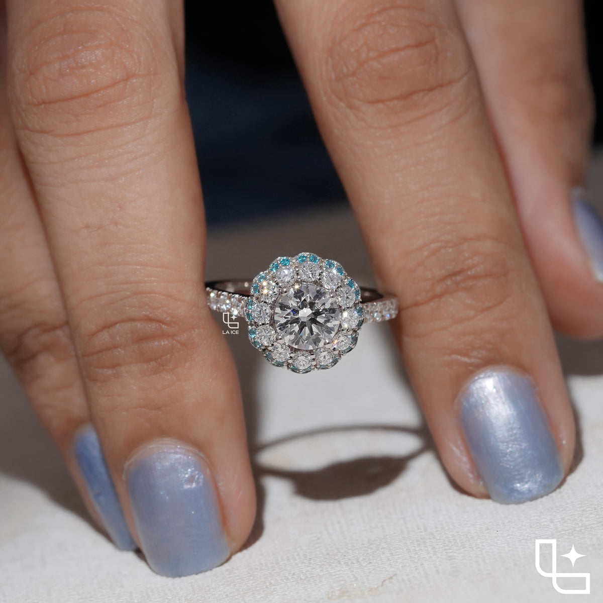 Round Cut Floral Halo Engagement Ring with Blue Accent Stones