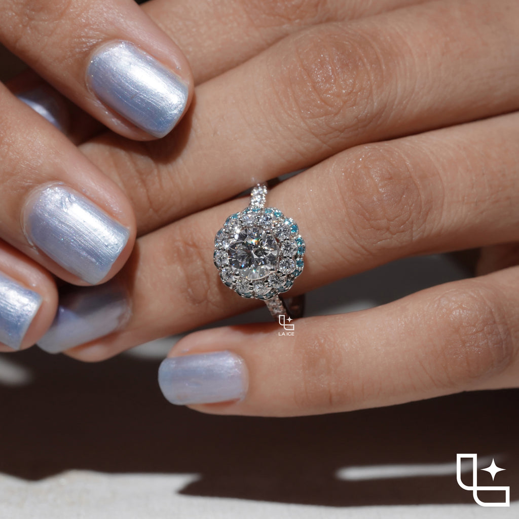 Round Cut Floral Halo Engagement Ring with Blue Accent Stones