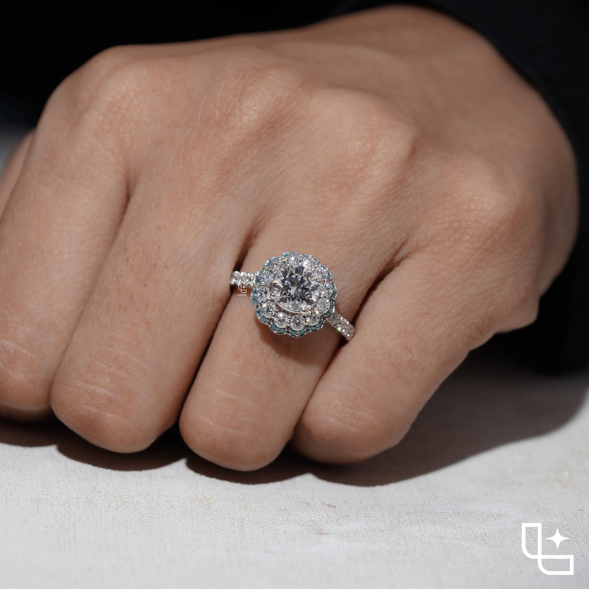 Round Cut Floral Halo Engagement Ring with Blue Accent Stones