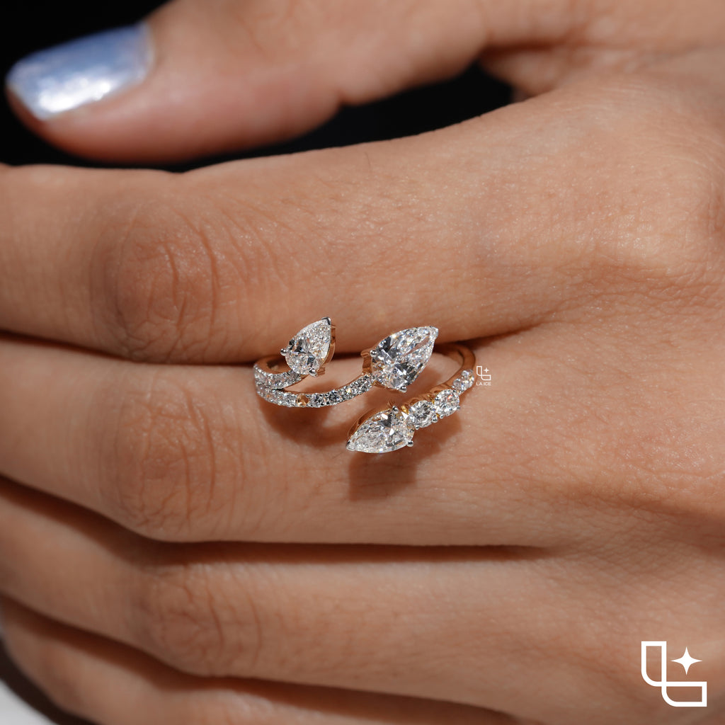 Three Stone Pear Cut Ring with Open Bypass Band and Pavé Accents