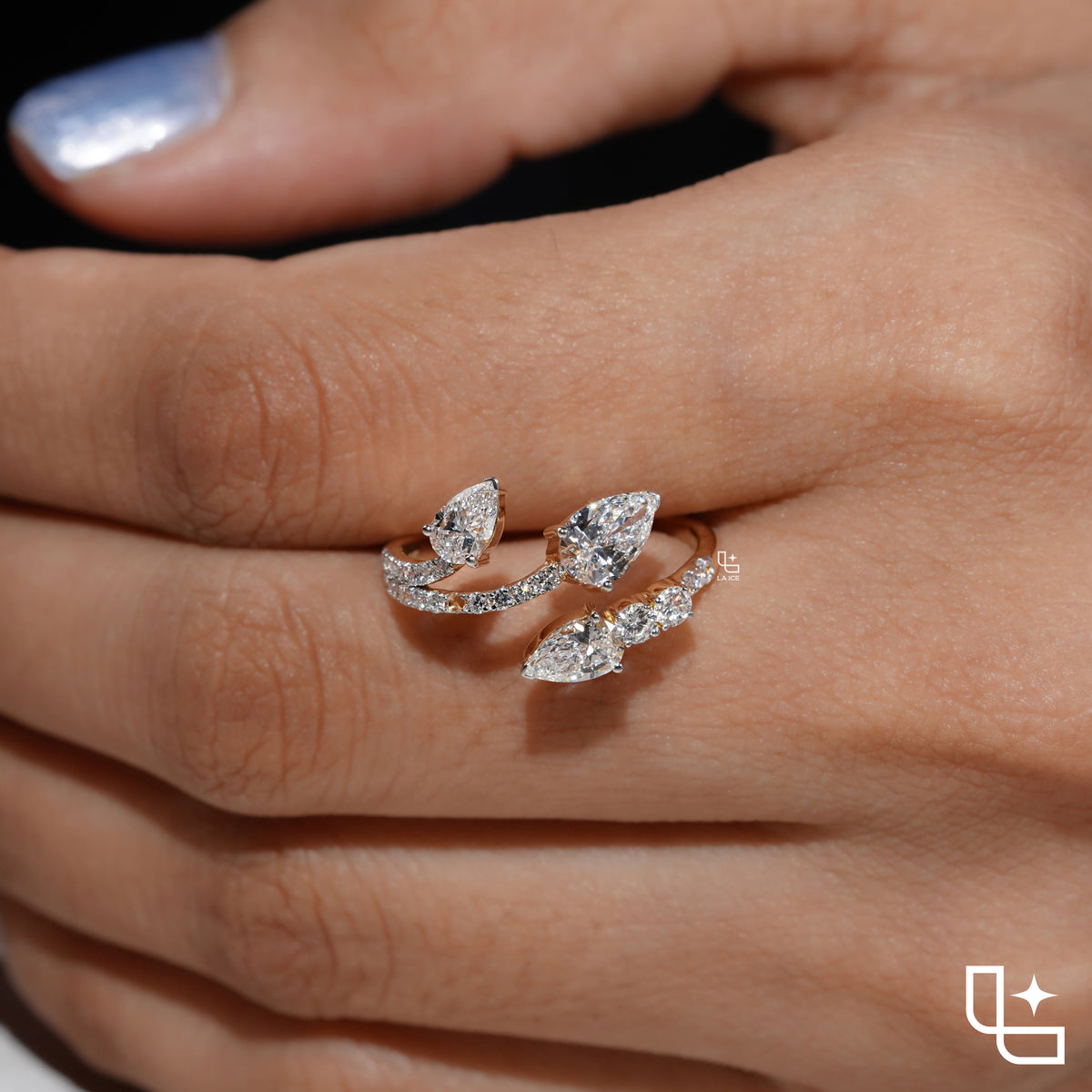 Three Stone Pear Cut Ring with Open Bypass Band and Pavé Accents